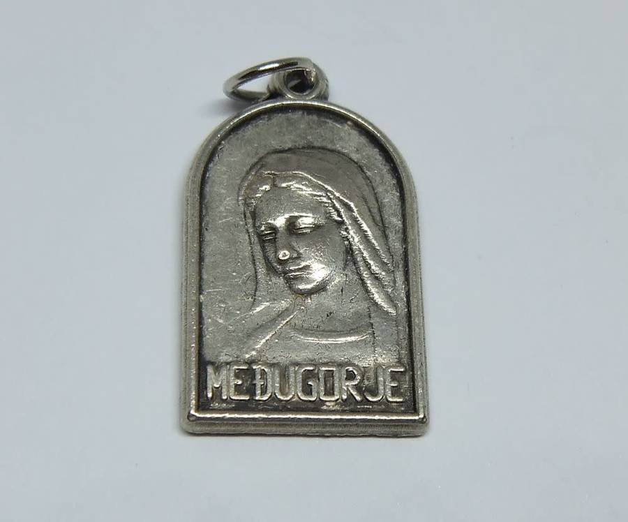 A lovely vintage solid metal religious pendant / medallion