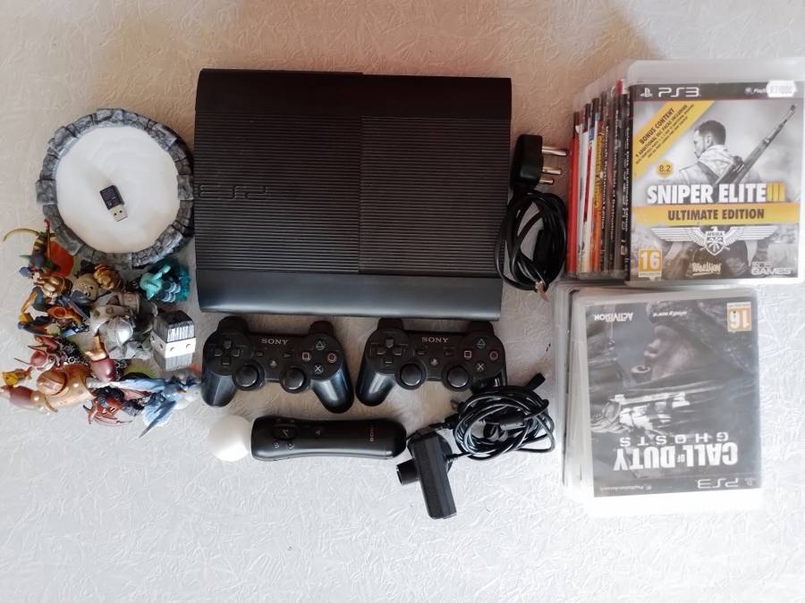 Ps3 Super Slim, remotes, games and Skylanders set