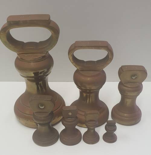 7 piece vintage brass bell weights
