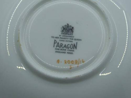 PARAGON VINTAGE GILDED AND SAGE-GREEN FOOTED TEA CUP AND SAUCER WITH CABBAGE ROSES.