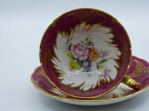 PARAGON GILDED AND CARDINAL RED VINTAGE TEA CUP DUO WITH CABBAGE ROSES .