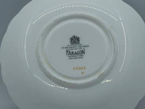 PARAGON GILDED AND CARDINAL RED VINTAGE TEA CUP DUO WITH CABBAGE ROSES .
