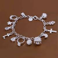 Silver charm bracelet with charms