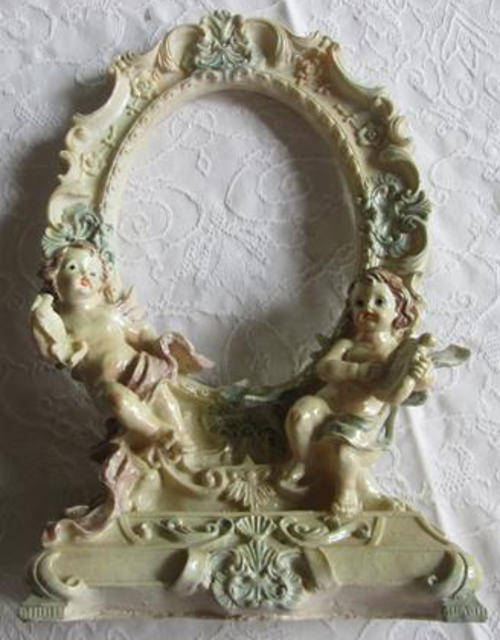 ROCOCCO STYLE, FIBRE CAST PICTURE / MIRROR FRAME DECORATED WITH CHERUBS.