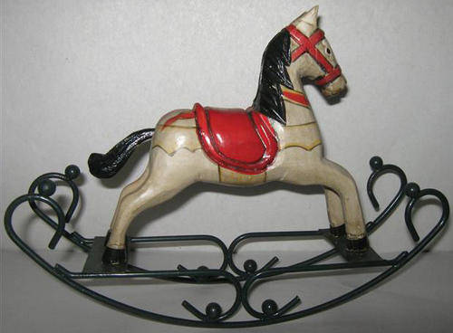VINTAGE LOOKING HAND CARVED WOODEN ROCKING HORSE ON WROUGHT IRON ROCKER.