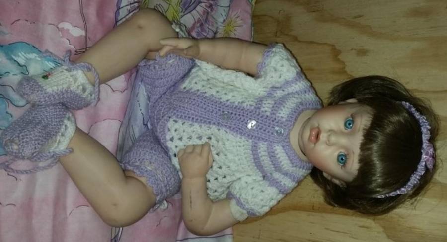 A PORCELAIN DOLL TO ADD TO YOUR COLLECTION