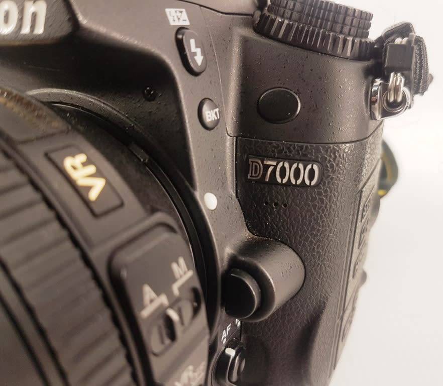 Nikon D7000 Camera Body with AF-S Nikkor 18-105mm 1:3.5-5.6G ED Lens Charger Battery Backpack