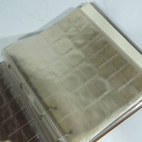 Used coin album with 11 pages