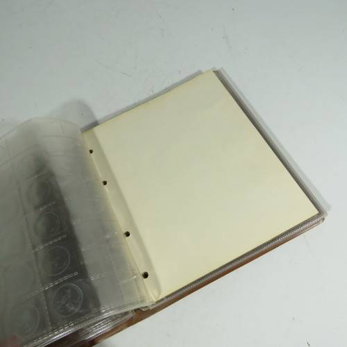 Used coin album with 11 pages
