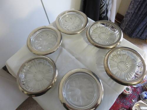 SIX ELEGANT GLASS AND SILVER COASTERS