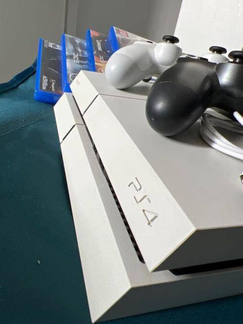 Play Station 4,  1TB, 2 controllers and 6 games