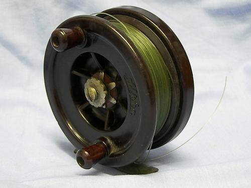 antique bakelite,centre pin fishing reel.