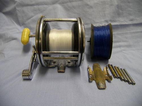 PENN 49 A . With conversion kit to narrow spool