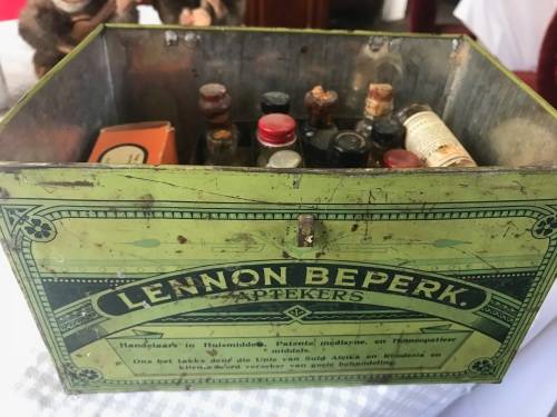Lennon se Egte Huis Apteek with some medicine in the original packing