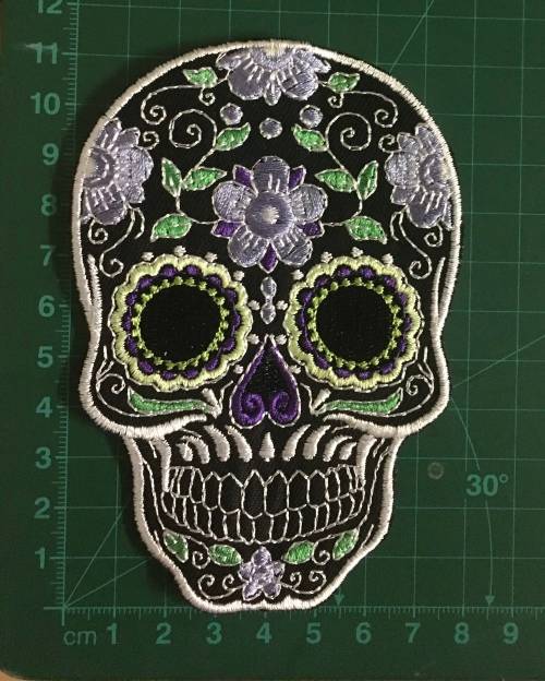 BDG315 Sugar skull badge patch in purple on black