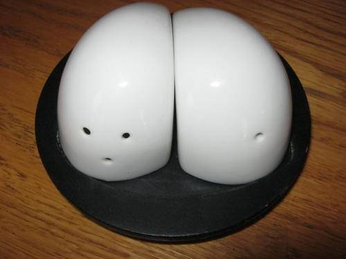 CUTE SET OF SALT AND PEPPER POTS WITH BLACK WOOD BASE
