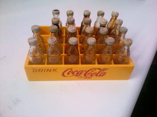 22 Glass coke bottles with plastic crate