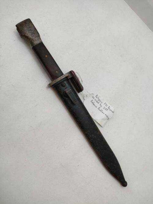 Belguim FN Bayonet and sheath. As used by SAP. Replaced wooden grips and release button missing.