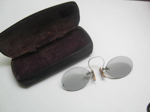 Antique pair of glasses in original case