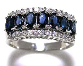 9k White gold plated sapphire and white topaz ring.   1.400cts