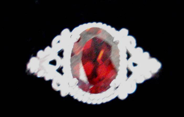 9k White gold plated Rhodolite  and white topaz ring.   1.200cts