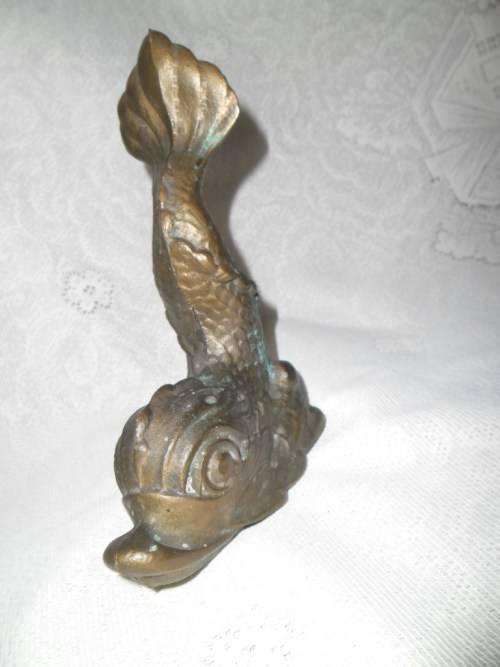 Vintage heavy cast bronze door stop in the form of a mythical sea creature