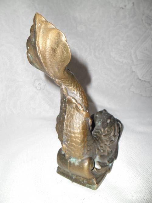Vintage heavy cast bronze door stop in the form of a mythical sea creature