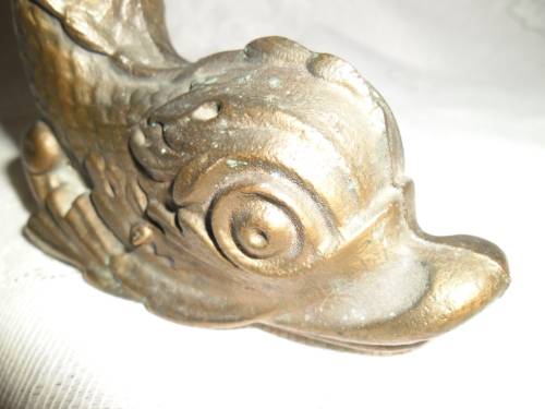 Vintage heavy cast bronze door stop in the form of a mythical sea creature