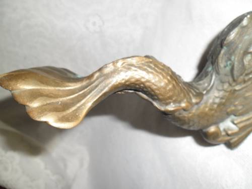 Vintage heavy cast bronze door stop in the form of a mythical sea creature