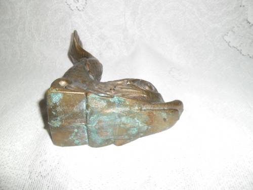 Vintage heavy cast bronze door stop in the form of a mythical sea creature