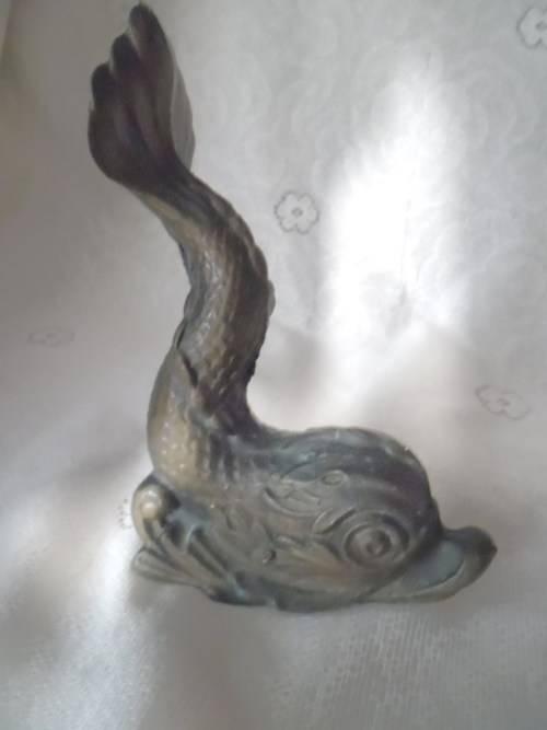 Vintage heavy cast bronze door stop in the form of a mythical sea creature