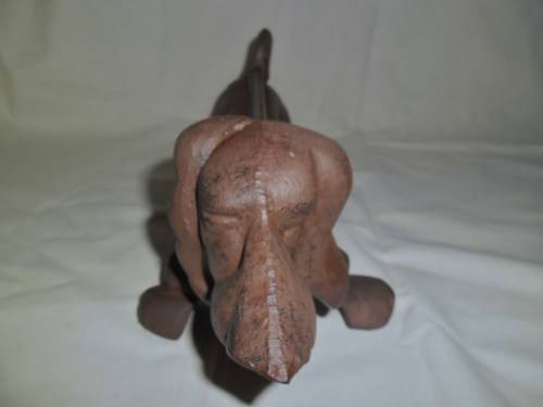 Cast iron sausage dog boot scraper or door stop