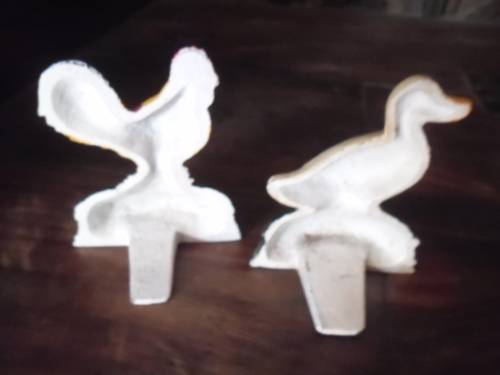 Pair of petite cast metal doorstops. Duck and chicken