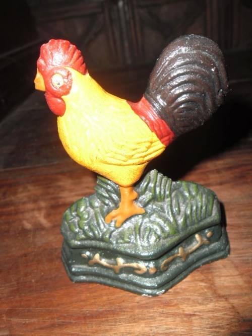 Pair of petite cast metal doorstops. Duck and chicken