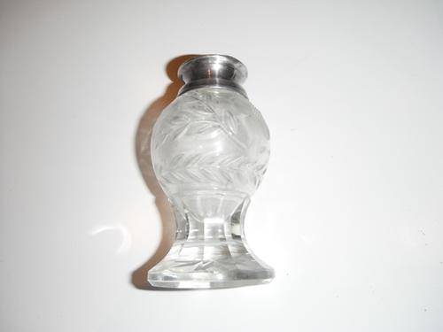a beautiful piece glass with sterling silver lid