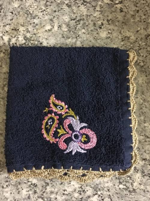 Embroidered face cloth with crochet border