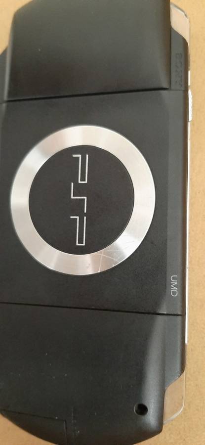 PSP Black console ( works 100% has a dirt speck in the screen)