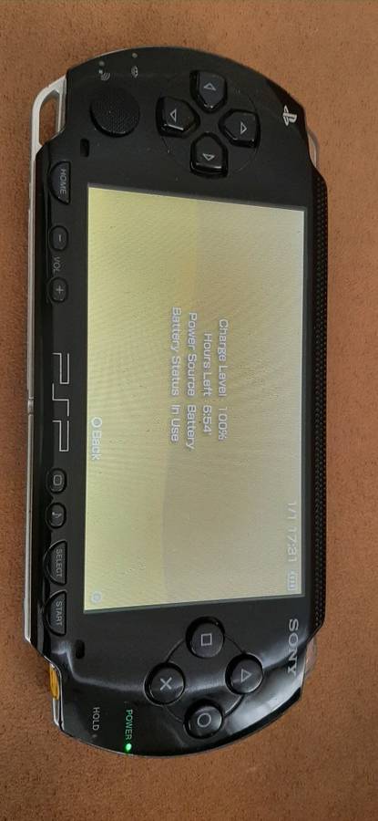 PSP Black console ( works 100% has a dirt speck in the screen)