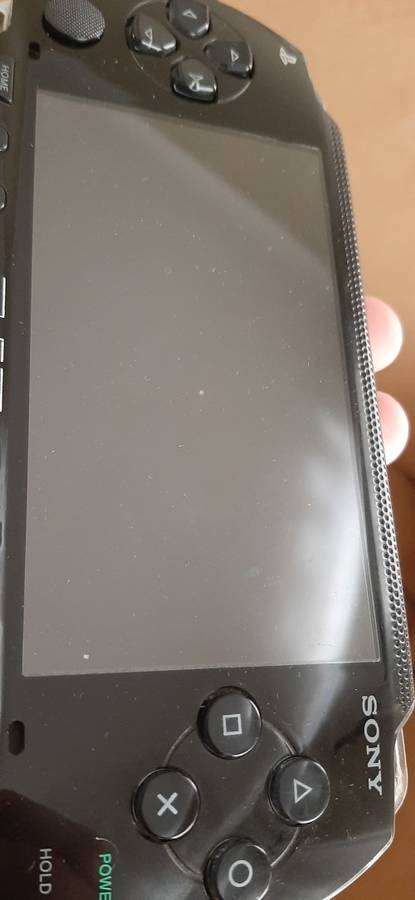 PSP Black console ( works 100% has a dirt speck in the screen)