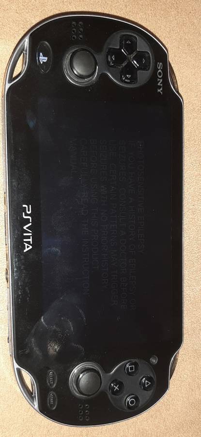 PS Vita 1004 Model ( Very Good Condition) + 1 game and 8 Gb memory card