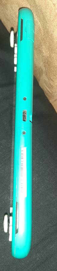 Nintendo Switch Lite ( Has a crack in the bottom housing) works 100%