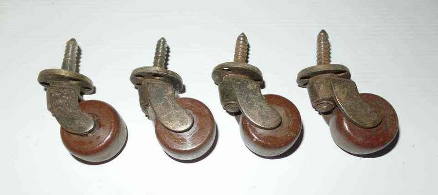 ANTIQUE BRASS & PORCELAIN CASTORS