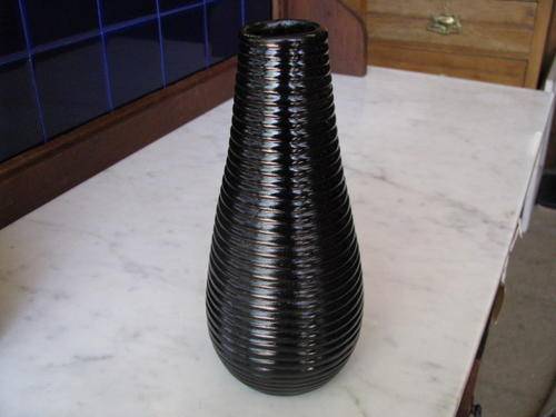 *** LOVELY OLD GLASS VASE.... BURGUNDY IN THE SUNLIGHT.***