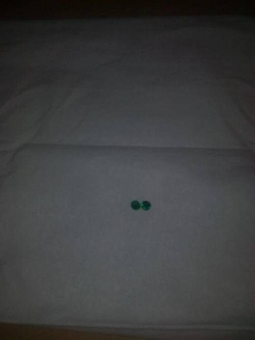 2 x 5.8mm round emeralds