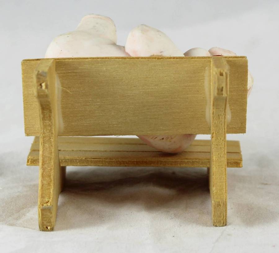 Quirky pig laying on bench