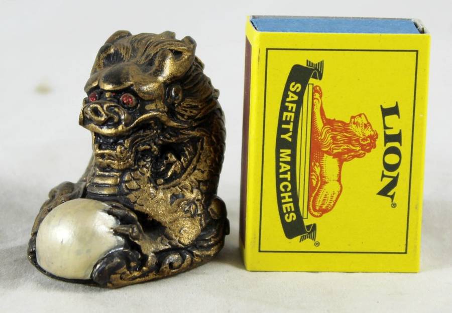 Small gold dragon with crystal ball