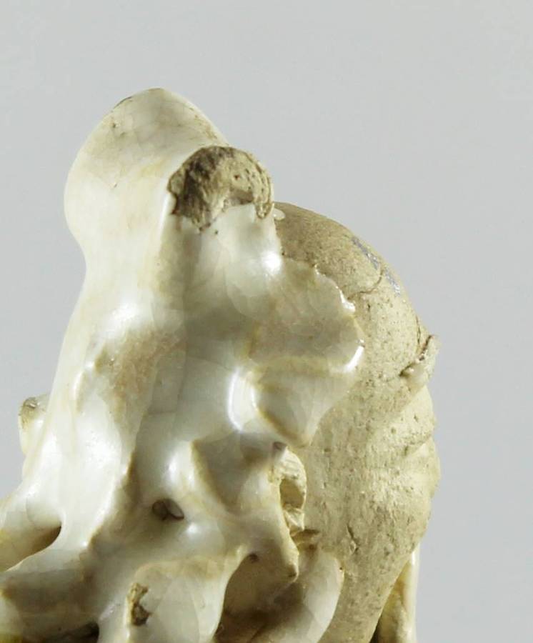 Mud man with big green pot