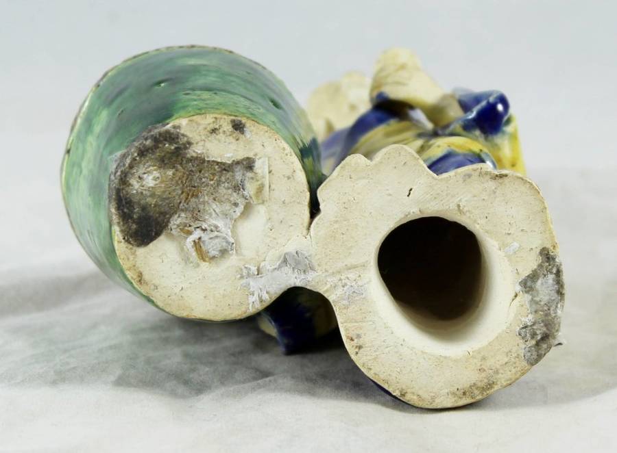 Mud man with big green pot