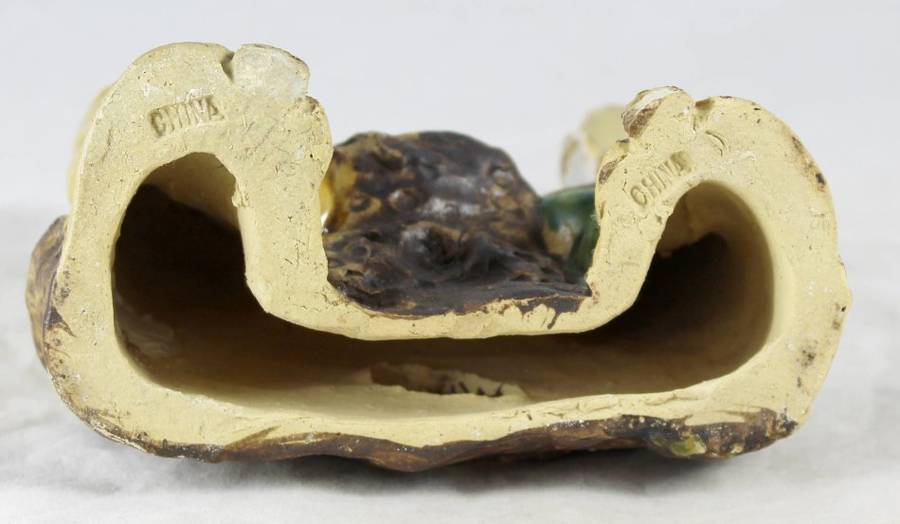 Mud man sitting and conversing