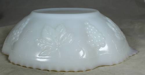 Milk glass bowl with grapes and a gold rim